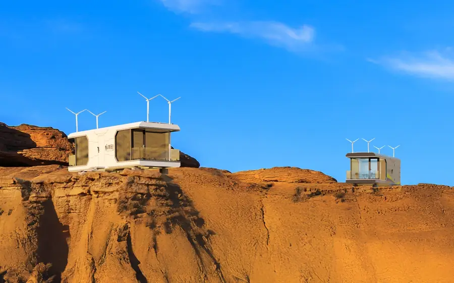 Two cabins on red rock outcrops in the Gobi