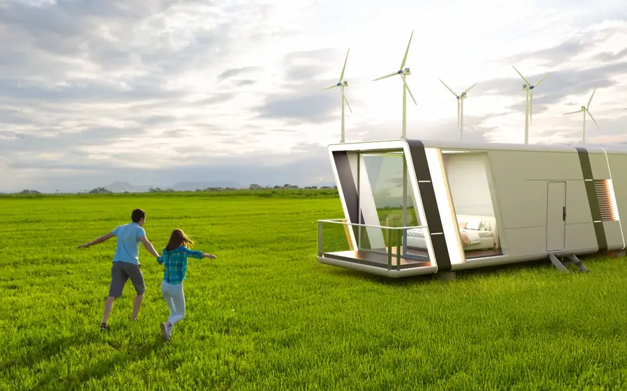 Cabin on green grassland with a family running towards it